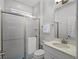 Bright bathroom with a glass enclosed shower and modern sink at 9128 Sonoma Coast Dr, Winter Garden, FL 34787