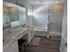 Elegant bathroom with a soaking tub, walk-in shower, dual vanity, and modern fixtures at 9128 Sonoma Coast Dr, Winter Garden, FL 34787