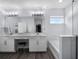 The bathroom features a double vanity, soaking tub, and a walk-in shower with glass doors at 9128 Sonoma Coast Dr, Winter Garden, FL 34787
