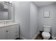 Bathroom with a white vanity and a wall mounted mirror at 9128 Sonoma Coast Dr, Winter Garden, FL 34787