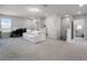 Large bonus room with neutral carpet, comfortable seating, workspace, and access to additional rooms at 9128 Sonoma Coast Dr, Winter Garden, FL 34787