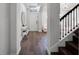 Elegant entryway featuring stylish console table, decorative mirror, and dark wood floors at 9128 Sonoma Coast Dr, Winter Garden, FL 34787