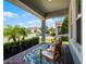 Inviting front porch with comfortable seating and stylish rug, perfect for relaxing outdoors at 9128 Sonoma Coast Dr, Winter Garden, FL 34787