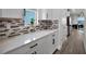 Stylish kitchen featuring sleek cabinetry, modern backsplash, and plenty of counter space at 9128 Sonoma Coast Dr, Winter Garden, FL 34787
