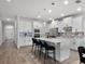 Modern kitchen featuring white cabinets, stainless steel appliances, and a center island with breakfast bar seating at 9128 Sonoma Coast Dr, Winter Garden, FL 34787