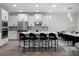Bright kitchen featuring white cabinets, stainless steel appliances, a center island, and dining area for entertaining guests at 9128 Sonoma Coast Dr, Winter Garden, FL 34787