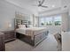 Spacious main bedroom with tray ceilings, large windows, plush carpet, and luxurious furniture at 9128 Sonoma Coast Dr, Winter Garden, FL 34787