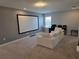 Spacious media room with a large screen and comfortable seating, perfect for movie nights at 9128 Sonoma Coast Dr, Winter Garden, FL 34787