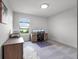 A well-lit home office features a scenic view, carpet, and comfortable work space at 9128 Sonoma Coast Dr, Winter Garden, FL 34787