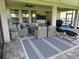 Stylish outdoor patio featuring comfortable seating, a ceiling fan, and a view of the backyard at 9128 Sonoma Coast Dr, Winter Garden, FL 34787