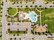 Aerial photograph features a sparkling community pool with ample parking and a playground for Gathering enjoyment at 9128 Sonoma Coast Dr, Winter Garden, FL 34787