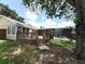 Inviting outdoor living space with deck perfect for entertaining, pool nearby at 926 Freshmeadow Ct, Apopka, FL 32703
