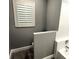 Bright, neutral bathroom features a tiled shower and vinyl flooring at 926 Freshmeadow Ct, Apopka, FL 32703