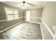 Neutral bedroom with gray walls, white trim and a ceiling fan at 926 Freshmeadow Ct, Apopka, FL 32703