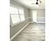 Bright bedroom featuring hard surface floors, natural light, and an overhead fan at 926 Freshmeadow Ct, Apopka, FL 32703
