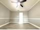 A clean bedroom features neutral paint and decorative ceiling trim at 926 Freshmeadow Ct, Apopka, FL 32703