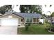 Charming single-story home with well-maintained lawn and attached garage at 926 Freshmeadow Ct, Apopka, FL 32703