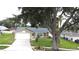 Traditional home with a well-manicured lawn and inviting curb appeal at 926 Freshmeadow Ct, Apopka, FL 32703