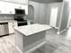 Modern kitchen featuring granite countertops, stainless steel appliances, and an island at 926 Freshmeadow Ct, Apopka, FL 32703