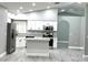 Spacious open kitchen with gray wood floors, granite countertops, and stainless steel appliances at 926 Freshmeadow Ct, Apopka, FL 32703