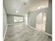 Large living area with modern gray walls, recessed lighting, and wood-look flooring at 926 Freshmeadow Ct, Apopka, FL 32703