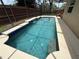 This pool is inviting with its waterfall feature and dolphin mosaics at 926 Freshmeadow Ct, Apopka, FL 32703
