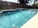 Relax in this pool featuring a waterfall feature and dolphin mosaics at 926 Freshmeadow Ct, Apopka, FL 32703
