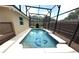 Inviting screened-in pool featuring dolphin mosaic and room for relaxation at 926 Freshmeadow Ct, Apopka, FL 32703