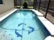 Relax in this pool featuring a waterfall feature and dolphin mosaics at 926 Freshmeadow Ct, Apopka, FL 32703