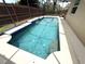 This pool is inviting with its waterfall feature and dolphin mosaics at 926 Freshmeadow Ct, Apopka, FL 32703