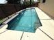 View of the inviting pool featuring a waterfall feature and dolphin mosaics at 926 Freshmeadow Ct, Apopka, FL 32703