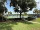Community tennis courts are surrounded by lush landscaping at 926 Freshmeadow Ct, Apopka, FL 32703