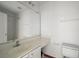Bathroom features large vanity, a sink, a mirror, and a toilet at 979 Mayfair St, Eustis, FL 32726