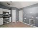 Traditional kitchen features stainless steel appliances, tile flooring and gray walls at 979 Mayfair St, Eustis, FL 32726