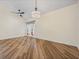 Spacious room with neutral walls, ceiling fan, window and wood-look flooring at 1111 Liberty Hall Dr, Kissimmee, FL 34746