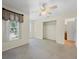 Spacious bedroom with a closet, ceiling fan, and an attached bathroom at 1111 Liberty Hall Dr, Kissimmee, FL 34746