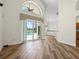 View from open living space into the kitchen with updated cabinets, counters, and views of the pool at 1111 Liberty Hall Dr, Kissimmee, FL 34746