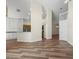 Bright, spacious living area showcasing the layout with modern wood floors and easy access to the kitchen at 1111 Liberty Hall Dr, Kissimmee, FL 34746