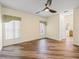 Living room offers wood-look flooring, windows, and natural light at 1111 Liberty Hall Dr, Kissimmee, FL 34746