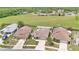 Aerial view of the homes showing well-kept lawns and landscaping at 1166 Mapimi Ct, Winter Springs, FL 32708