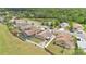 Aerial view of homes featuring a pool, fire pit, covered patio, and fenced yard at 1166 Mapimi Ct, Winter Springs, FL 32708