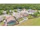 Aerial view of the houses featuring a fire pit and fenced backyard at 1166 Mapimi Ct, Winter Springs, FL 32708