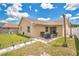 Nice backyard with a covered patio, fire pit area, and well-maintained lawn at 1166 Mapimi Ct, Winter Springs, FL 32708