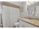 Bright bathroom with granite vanity top, updated fixtures and tiled shower with a curtain at 1166 Mapimi Ct, Winter Springs, FL 32708