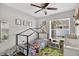 bedroom features unique bed frame, playful decor and a window at 1166 Mapimi Ct, Winter Springs, FL 32708