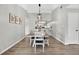 Dining area with a modern light fixture and views into the kitchen and living room at 1166 Mapimi Ct, Winter Springs, FL 32708