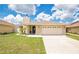 Attractive one-story home with a brick-accented facade and a two-car garage at 1166 Mapimi Ct, Winter Springs, FL 32708