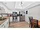 Modern kitchen with white cabinets, granite countertops, stainless steel appliances and light wood flooring at 1166 Mapimi Ct, Winter Springs, FL 32708