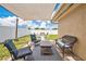 Covered patio with outdoor seating and a view of the fenced backyard at 1166 Mapimi Ct, Winter Springs, FL 32708