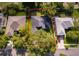 Aerial view of the home showcasing its layout, mature trees, and surrounding neighborhood at 1173 Valley Creek Run, Winter Park, FL 32792